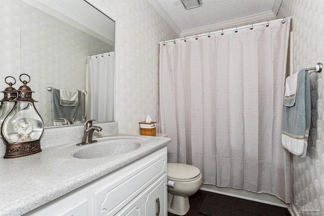 bathroom featuring tile patterned floors, vanity, ornamental molding, and a textured ceiling