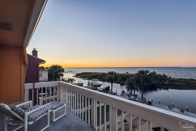 balcony at dusk with a water view