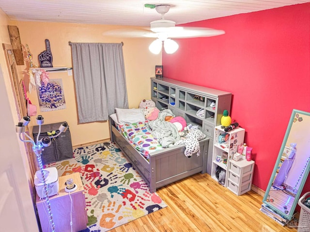 bedroom featuring ceiling fan and wood finished floors