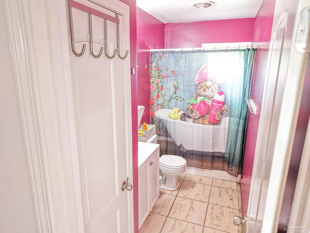 bathroom with toilet and vanity