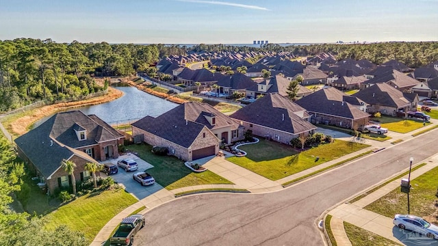 bird's eye view with a residential view and a water view