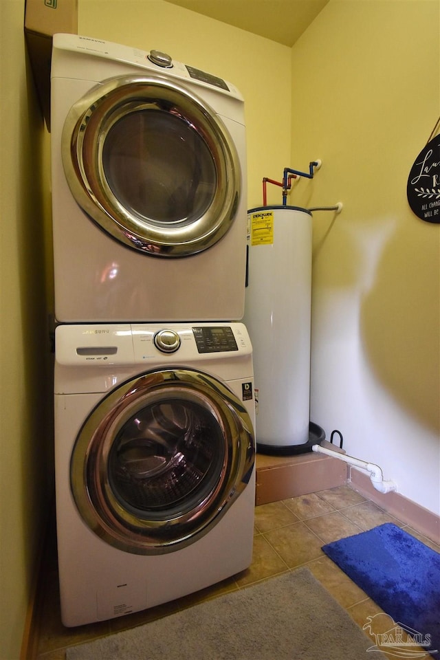 1430 Regency Rd Unit J101, Gulf Shores, AL 36542 - washroom with stacked washer / drying machine and water heater