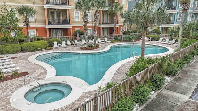 1430 Regency Rd Unit J101, Gulf Shores, AL 36542 - community pool with a hot tub and a patio area