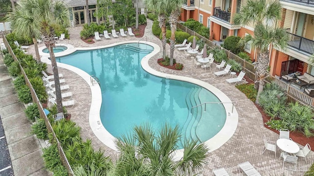 1430 Regency Rd Unit J101, Gulf Shores, AL 36542 - community pool featuring a patio area and a community hot tub