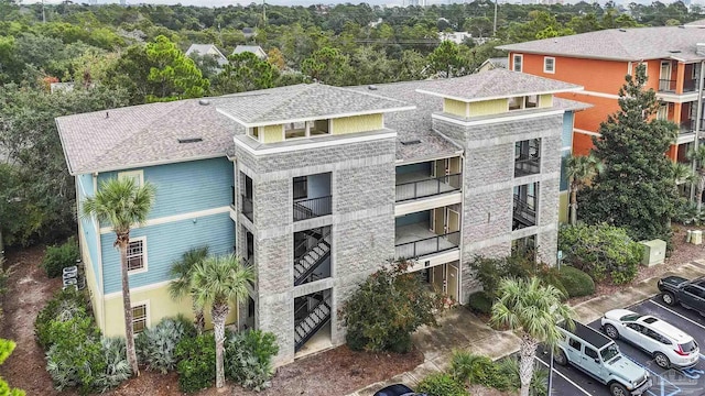 1430 Regency Rd Unit J101, Gulf Shores, AL 36542 - view of property featuring uncovered parking