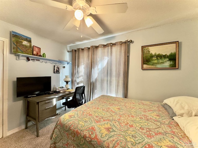 bedroom featuring a textured ceiling, carpet, a ceiling fan, and baseboards