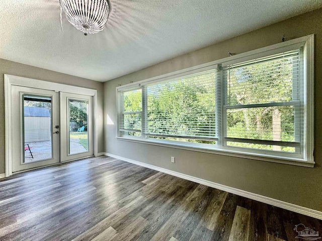 unfurnished sunroom featuring french doors