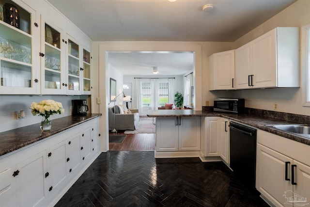 kitchen with black dishwasher, dark stone countertops, white cabinets, and dark parquet floors