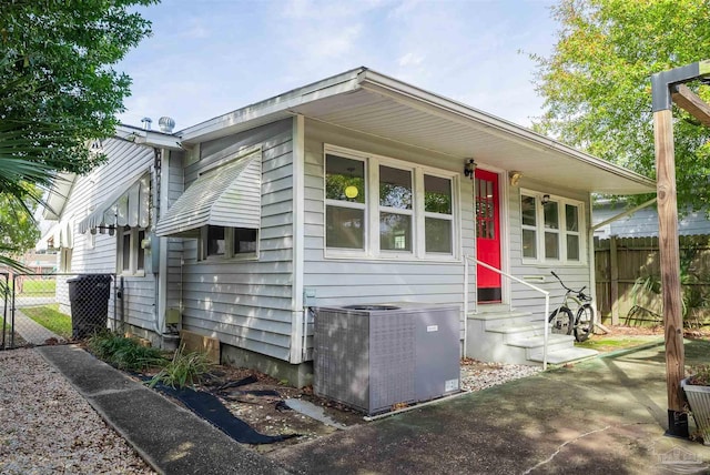 bungalow-style house with central AC