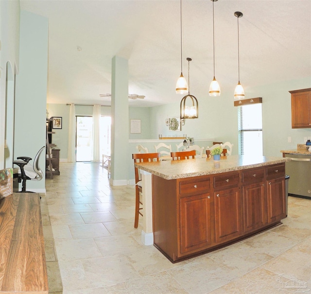 4794 Hilarita Cir, Pace, FL 32571 - kitchen featuring stainless steel dishwasher, plenty of natural light, a breakfast bar area, and a kitchen island