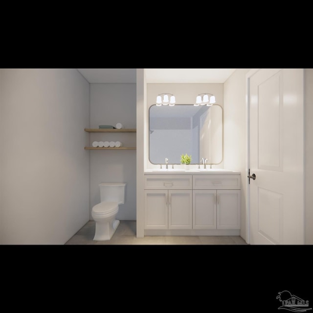 bathroom with vanity and toilet