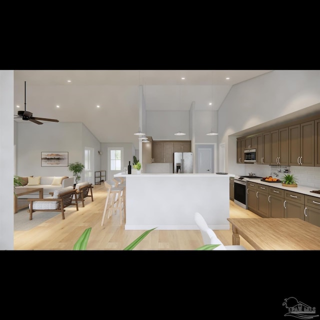 kitchen featuring ceiling fan, a center island, stainless steel appliances, decorative backsplash, and light wood-type flooring