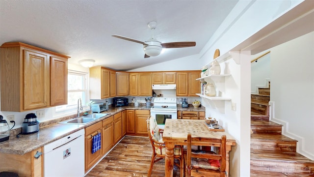 kitchen with white appliances, light wood-type flooring, under cabinet range hood, open shelves, and a sink