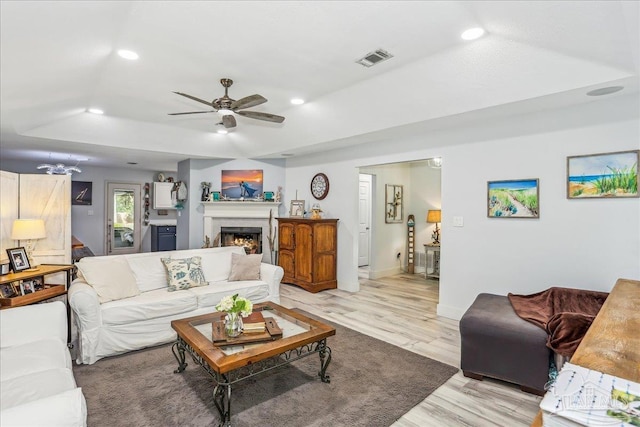 6961 Elliots Gin Ln, Navarre, FL 32566 - living room featuring recessed lighting, light wood-style floors, ceiling fan, baseboards, and a lit fireplace