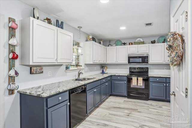 6961 Elliots Gin Ln, Navarre, FL 32566 - kitchen featuring black appliances, a sink, hanging light fixtures, white cabinetry, and recessed lighting
