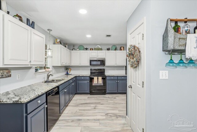 6961 Elliots Gin Ln, Navarre, FL 32566 - kitchen with black appliances, gray cabinetry, a sink, pendant lighting, and recessed lighting
