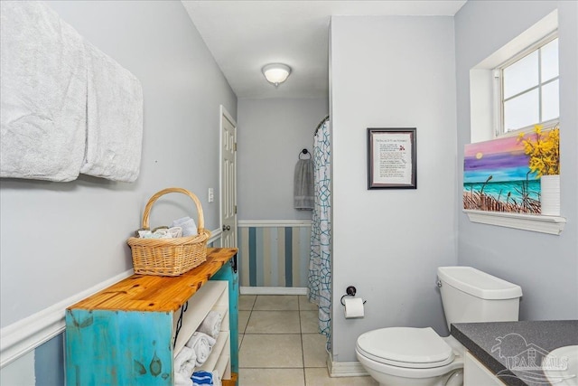 6961 Elliots Gin Ln, Navarre, FL 32566 - full bathroom featuring vanity, toilet, tile patterned flooring, and a shower with shower curtain