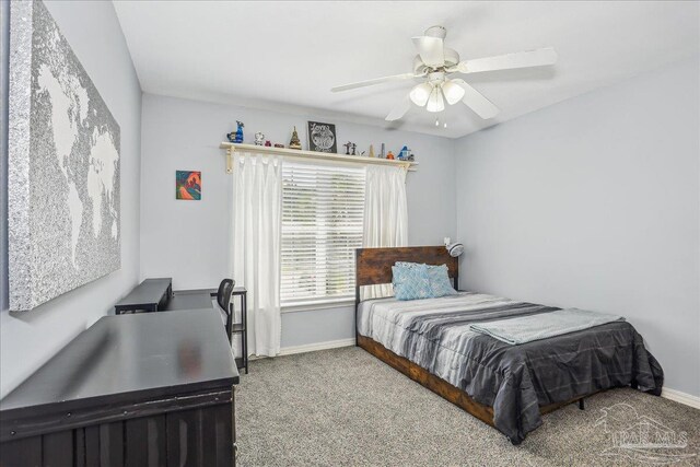 6961 Elliots Gin Ln, Navarre, FL 32566 - carpeted bedroom with baseboards and ceiling fan