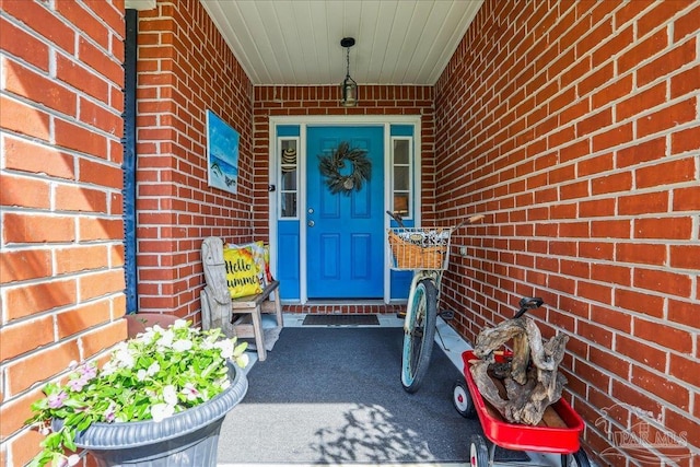 6961 Elliots Gin Ln, Navarre, FL 32566 - property entrance featuring brick siding and a porch
