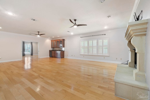 2960 Laurel Dr, Gulf Breeze, FL 32563 - unfurnished living room featuring ceiling fan, crown molding, light wood-style flooring, recessed lighting, and baseboards