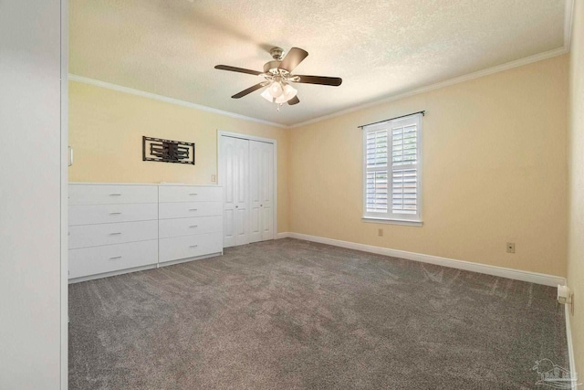 2960 Laurel Dr, Gulf Breeze, FL 32563 - unfurnished bedroom featuring a textured ceiling, ornamental molding, carpet flooring, a closet, and baseboards