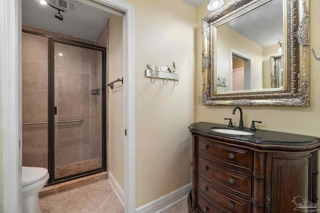 2960 Laurel Dr, Gulf Breeze, FL 32563 - full bath featuring a stall shower, toilet, vanity, baseboards, and tile patterned floors