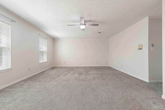 2960 Laurel Dr, Gulf Breeze, FL 32563 - carpeted empty room with a textured ceiling, a ceiling fan, crown molding, and baseboards