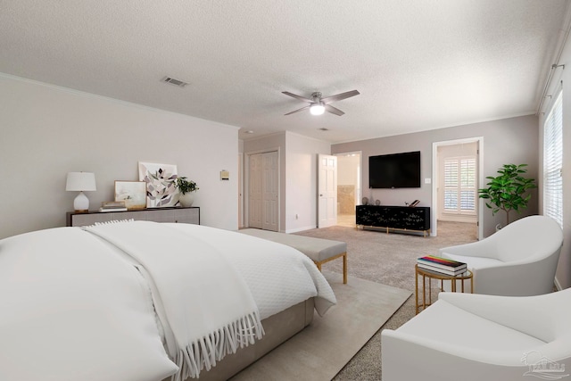 2960 Laurel Dr, Gulf Breeze, FL 32563 - bedroom featuring light carpet, a textured ceiling, crown molding, a ceiling fan, and ensuite bath