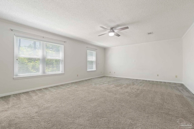 2960 Laurel Dr, Gulf Breeze, FL 32563 - carpeted empty room with a textured ceiling, ceiling fan, and baseboards