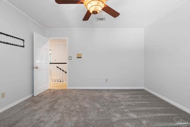 2960 Laurel Dr, Gulf Breeze, FL 32563 - spare room with ceiling fan, carpet floors, ornamental molding, a textured ceiling, and baseboards