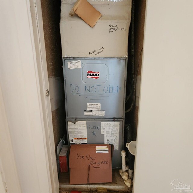 utility room with heating unit