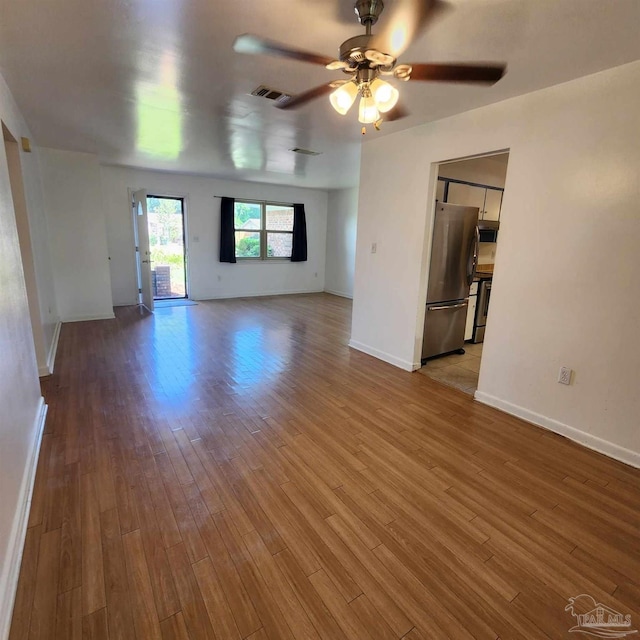 interior space with ceiling fan and hardwood / wood-style floors