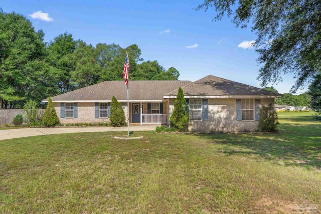 6299 Anderson Ln, Milton, FL 32570 - ranch-style house with brick siding and a porch