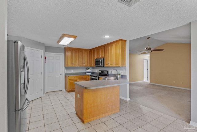 6299 Anderson Ln, Milton, FL 32570 - kitchen with appliances with stainless steel finishes, light tile patterned floors, a peninsula, open floor plan, and ceiling fan