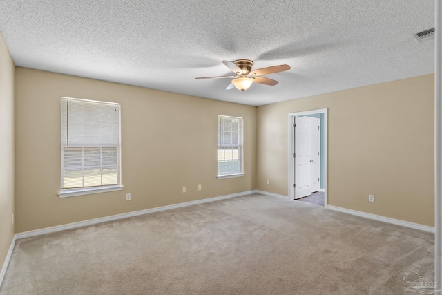 6299 Anderson Ln, Milton, FL 32570 - unfurnished room with light carpet, ceiling fan, and a textured ceiling