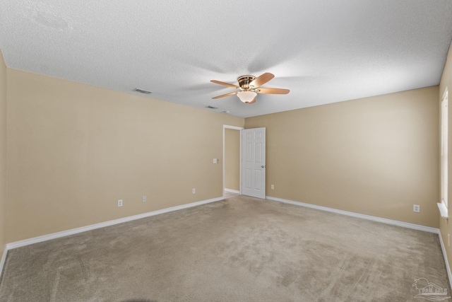 6299 Anderson Ln, Milton, FL 32570 - spare room featuring ceiling fan, carpet, and a textured ceiling
