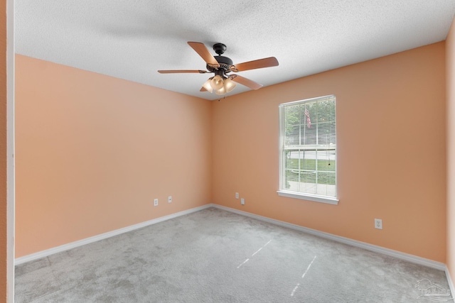 6299 Anderson Ln, Milton, FL 32570 - empty room featuring light colored carpet, a ceiling fan, and a textured ceiling