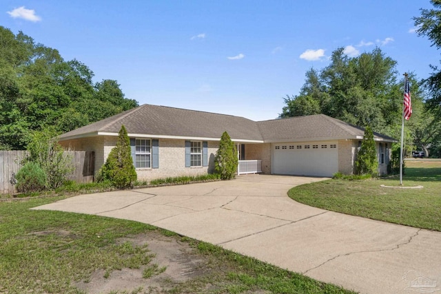 6299 Anderson Ln, Milton, FL 32570 - ranch-style house featuring brick siding, an attached garage, and concrete driveway