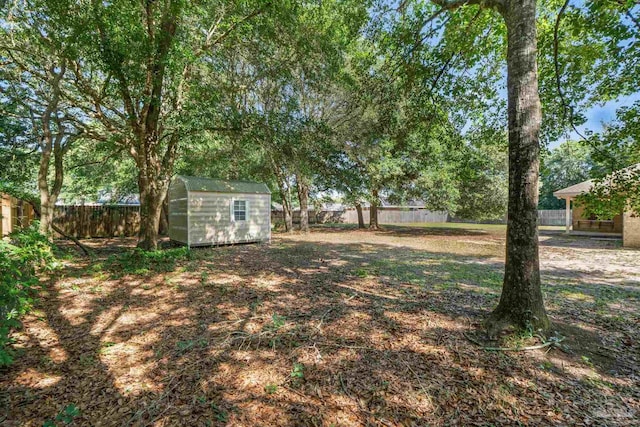 6299 Anderson Ln, Milton, FL 32570 - fenced backyard with a storage shed
