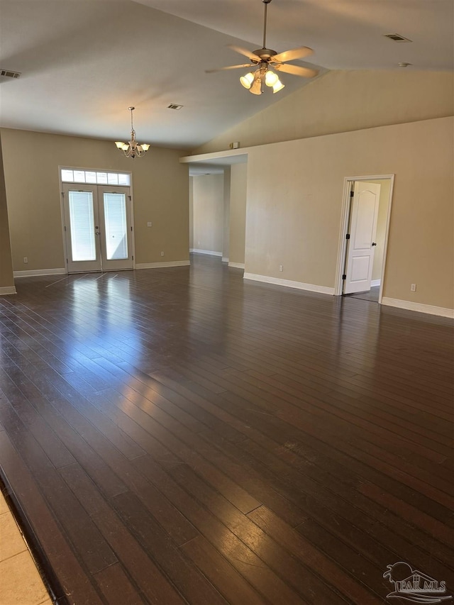 spare room with visible vents, dark wood finished floors, and ceiling fan with notable chandelier