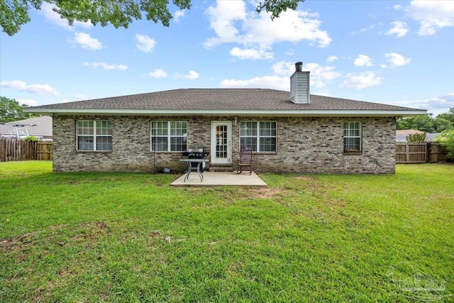 5761 Twisted Oak Ct, Pace, FL 32571 - rear view of property featuring a fenced backyard, a patio, a yard, and a chimney