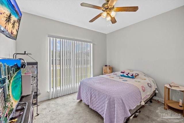 5761 Twisted Oak Ct, Pace, FL 32571 - bedroom featuring carpet floors, a ceiling fan, baseboards, and access to exterior
