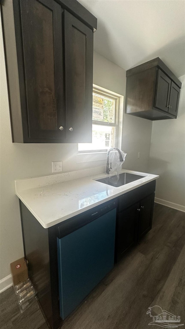 6280 Long St, Milton, FL 32570 - kitchen featuring dark wood-style floors, light countertops, and dishwashing machine