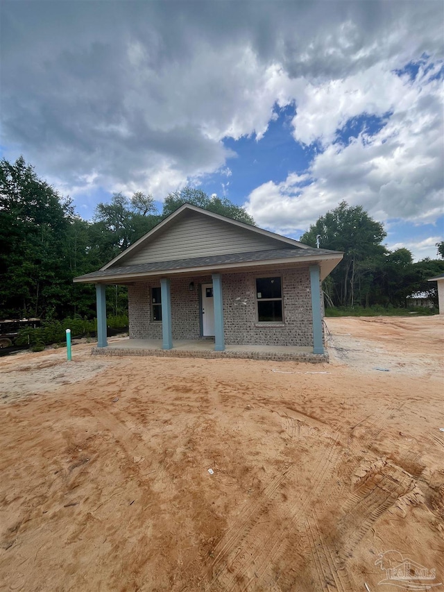 6280 Long St, Milton, FL 32570 - view of front of home featuring brick siding and a porch