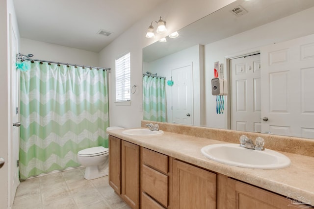 1408 Dunhurst Dr, Pensacola, FL 32534 - bathroom featuring a sink, toilet, double vanity, and a shower with shower curtain
