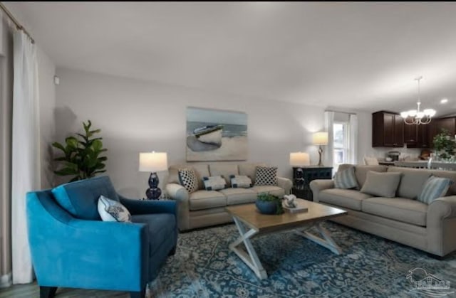 living room featuring a notable chandelier