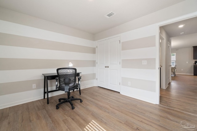 home office featuring recessed lighting, wood finished floors, visible vents, and baseboards