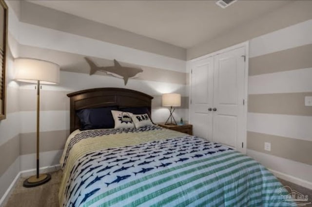 bedroom with a closet and carpet flooring