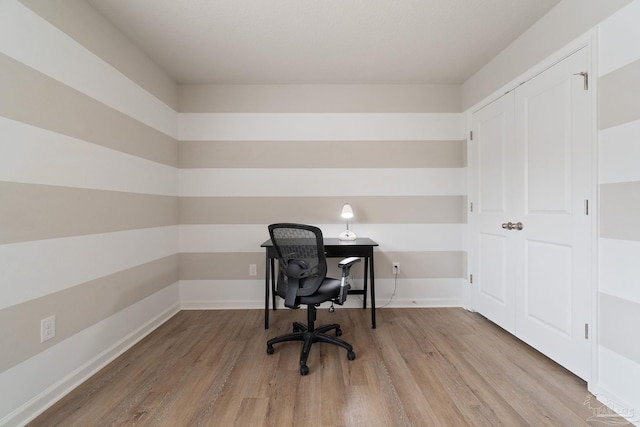 office with light wood finished floors and baseboards