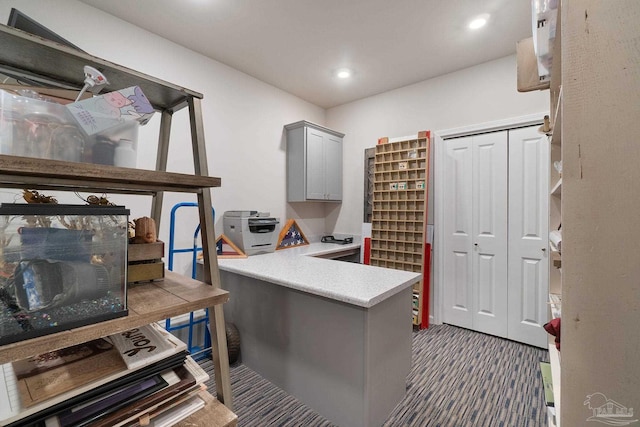 home office with dark carpet and recessed lighting